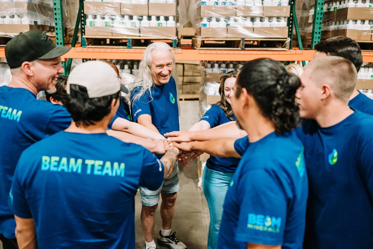 The BEAM Minerals team huddled together in their Grand Junction, Colorado warehouse